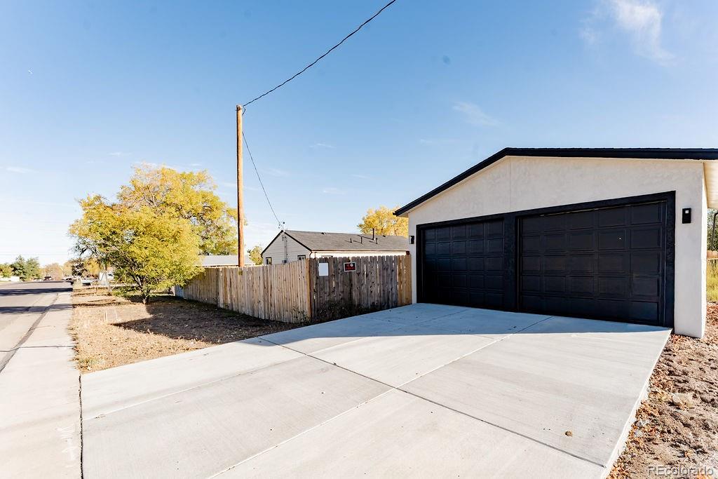 1105 South Raleigh Street Denver, CO 80219 - Photo 3 of 23 a view of a house with a garage