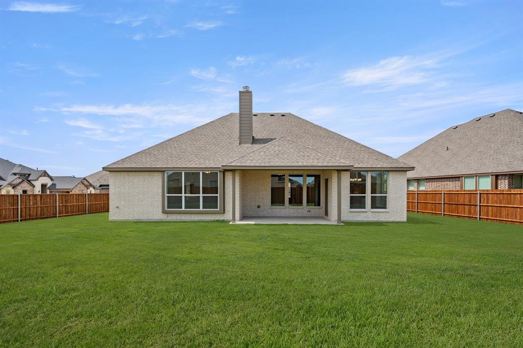 104 Calf Lane Midlothian, TX 76065 - Photo 25 of 29 a front view of a house with a garden