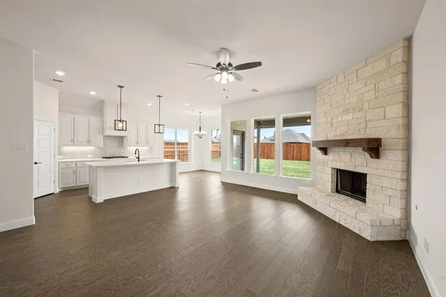 a view of kitchen with cabinets and wooden floor