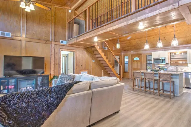 a en suite bathroom with a granite countertop sink and a mirror