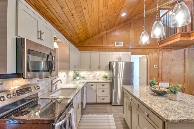 a view of a living room and chandelier
