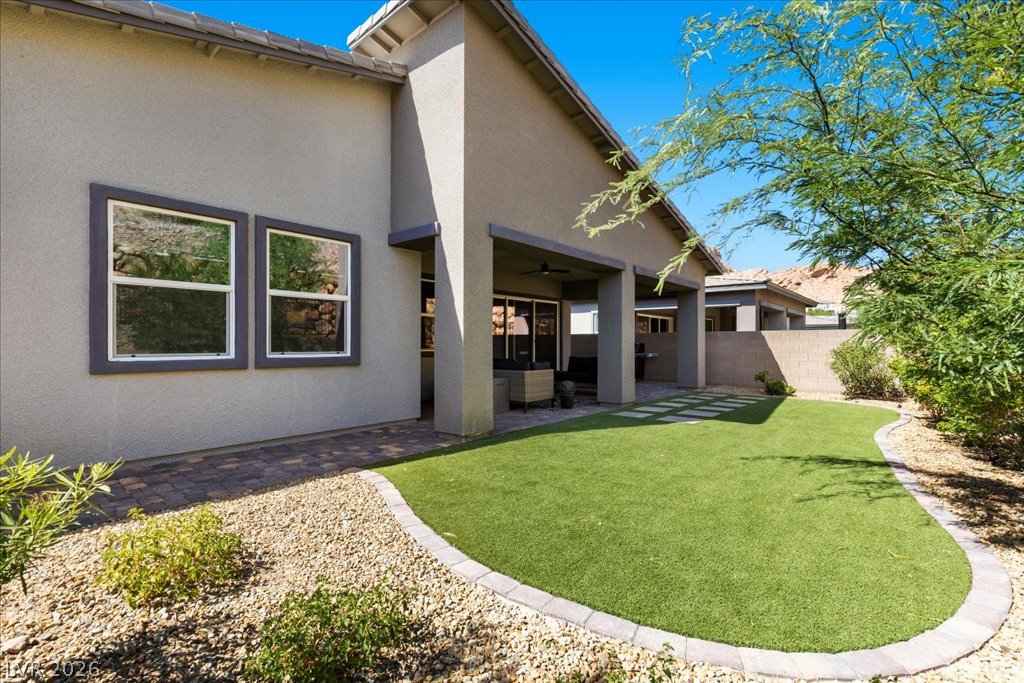 20 Charlotte Ridge Place Henderson, NV 89011 - Photo 29 of 33 A private outdoor space with a covered patio and low-maintenance landscaping for effortless entertaining.