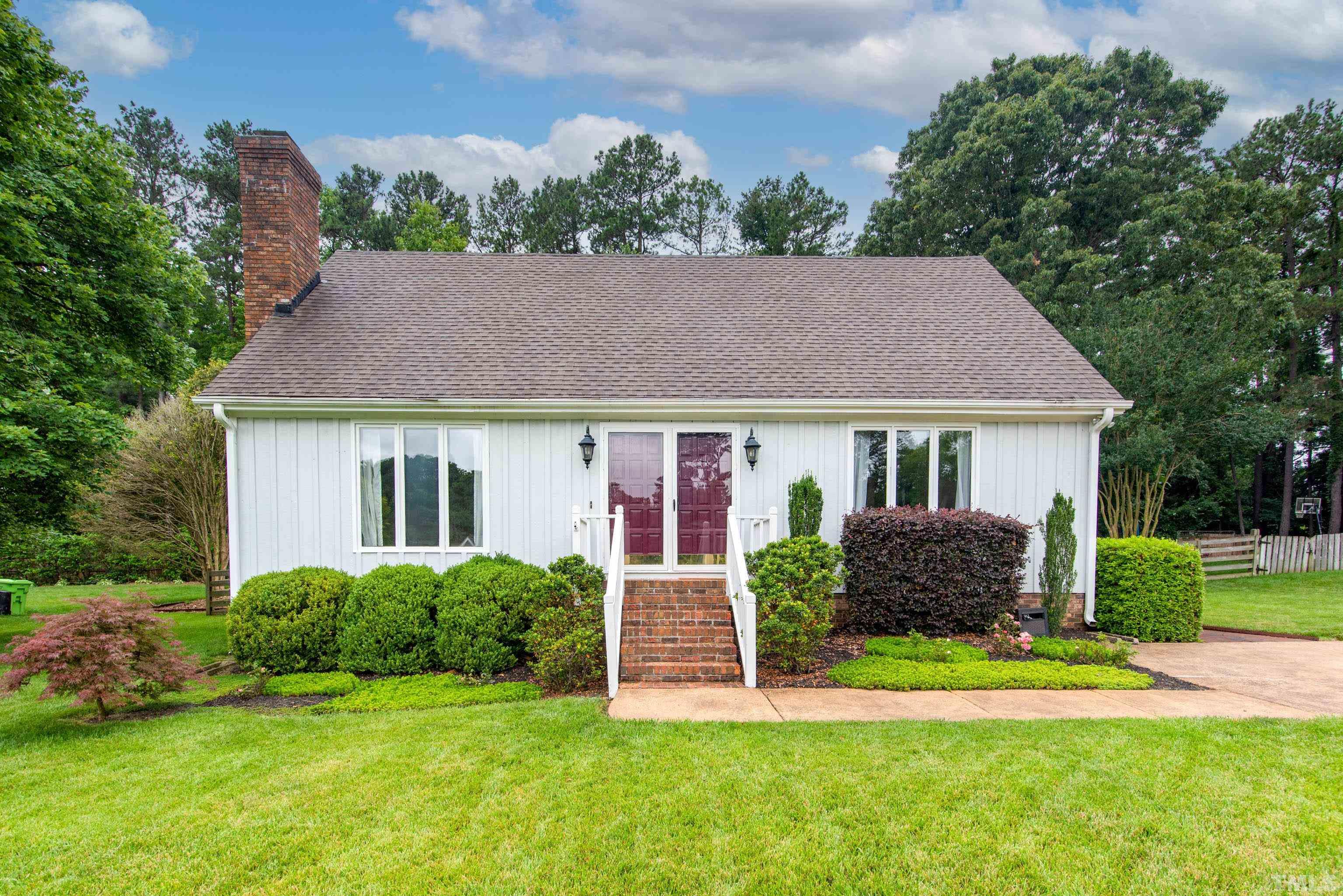 4225 Tolchester Place Raleigh, NC 27613 - Photo 1 of 35 a front view of house with yard and green space