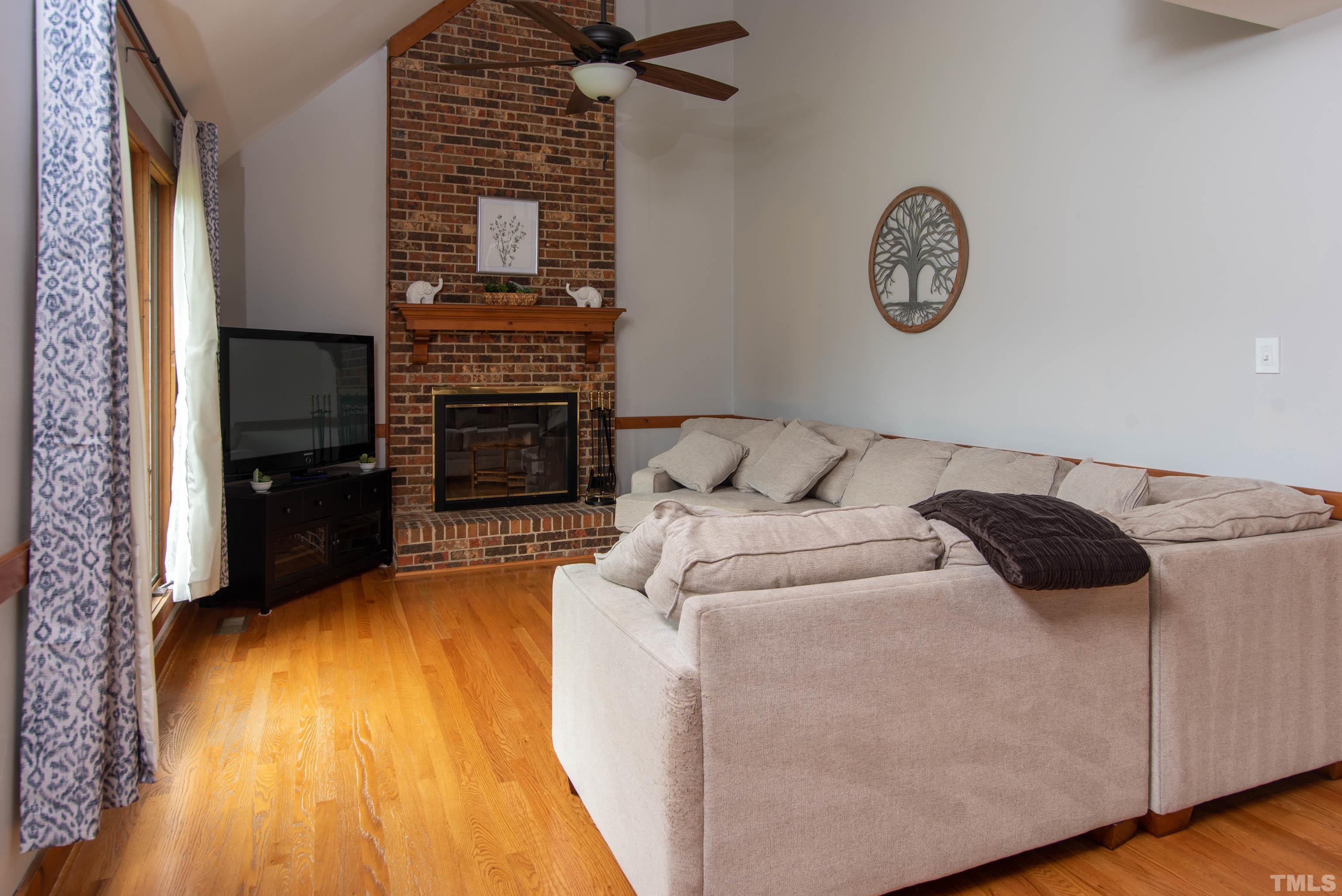 4225 Tolchester Place Raleigh, NC 27613 - Photo 3 of 35 a bedroom with a bed and a fireplace