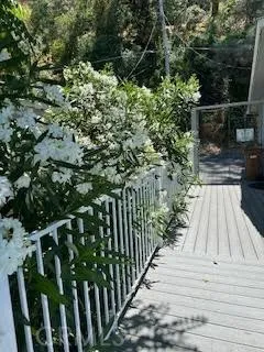 a view of balcony and yard