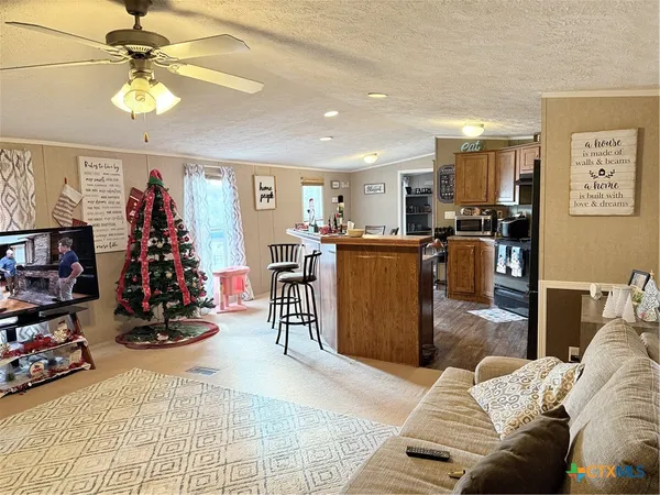 a view of a livingroom with workspace and a couch