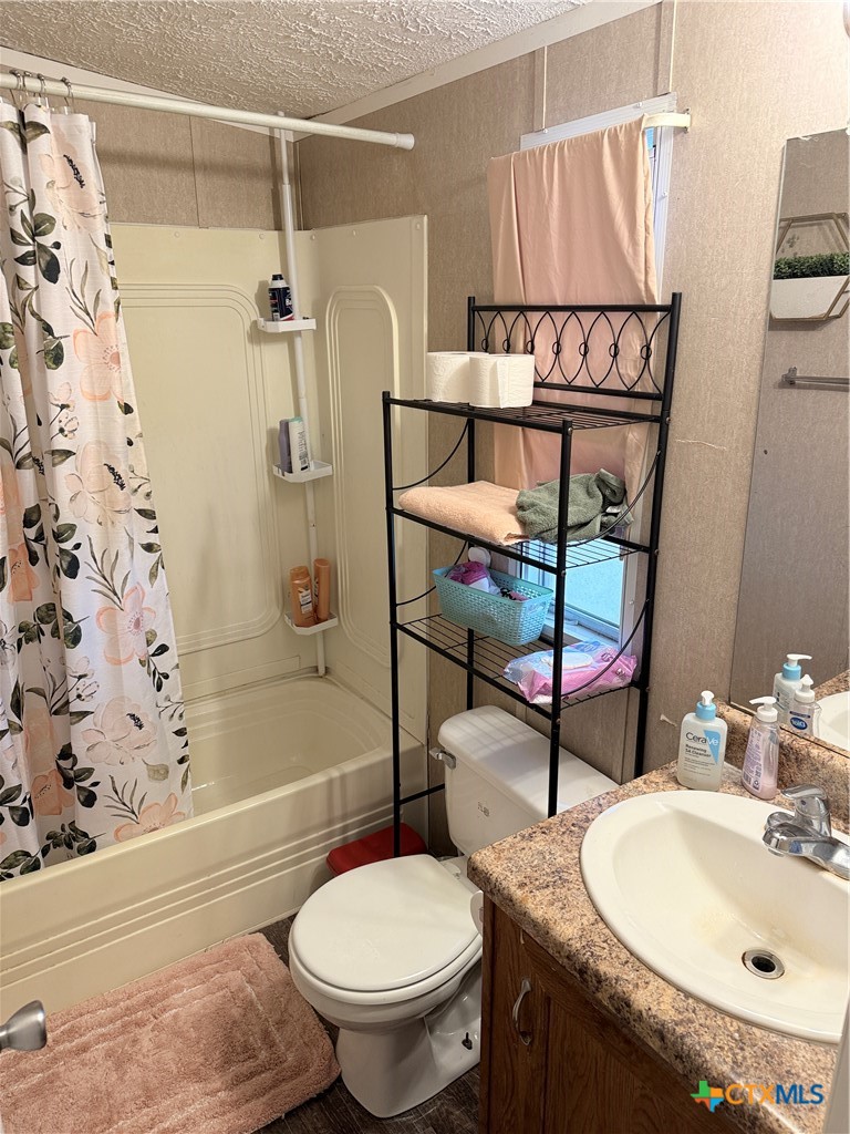 107 Dallas Street Goliad, TX 77963 - Photo 20 of 28 a bathroom with a sink toilet and shower