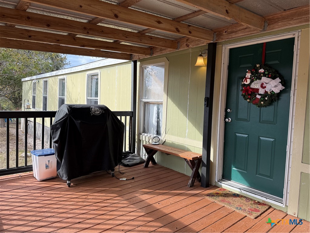 107 Dallas Street Goliad, TX 77963 - Photo 2 of 28 a view of entryway with wooden floor