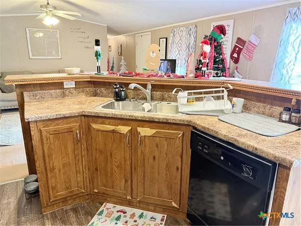 a view of a kitchen sink microwave and stove