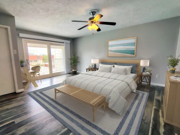 a spacious bedroom with a bed and a window