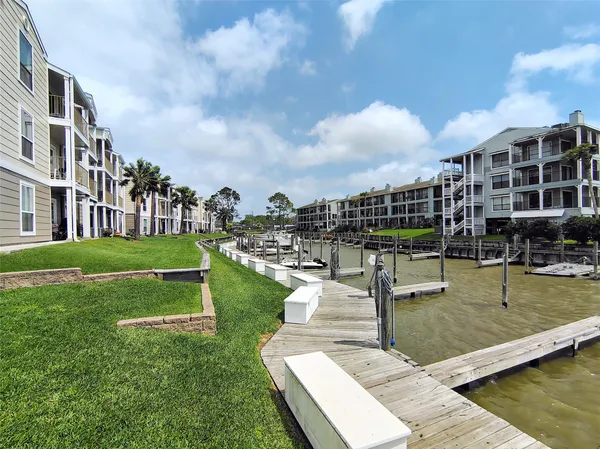 a view of a swimming pool and a yard