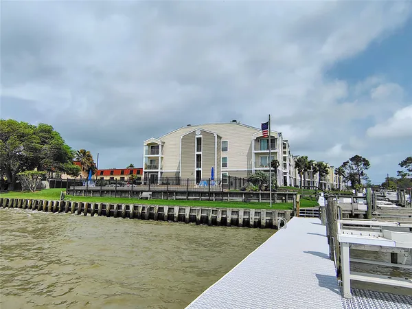a front view of a house with a lake view