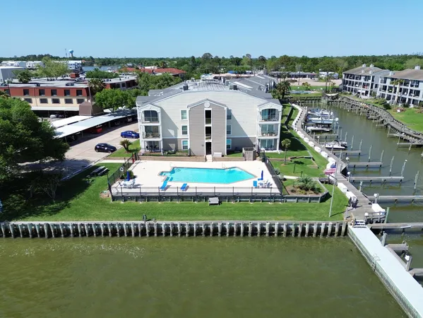 an aerial view of a house with a lake view