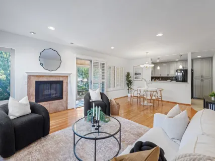 a living room with furniture couches and a fireplace