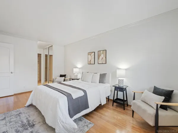 a spacious bedroom with a bed and a couch