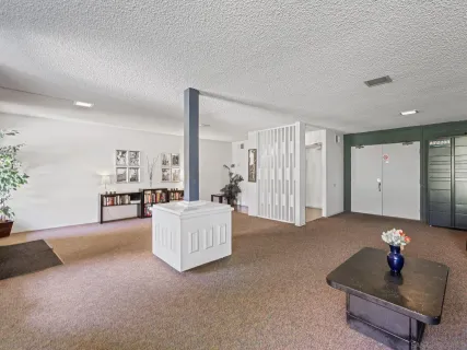 a living room with furniture and a table