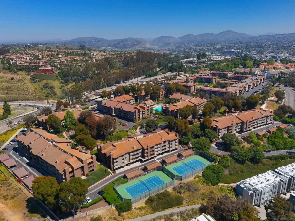 an aerial view of residential houses with outdoor space