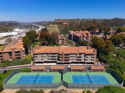a aerial view of multiple houses with a yard