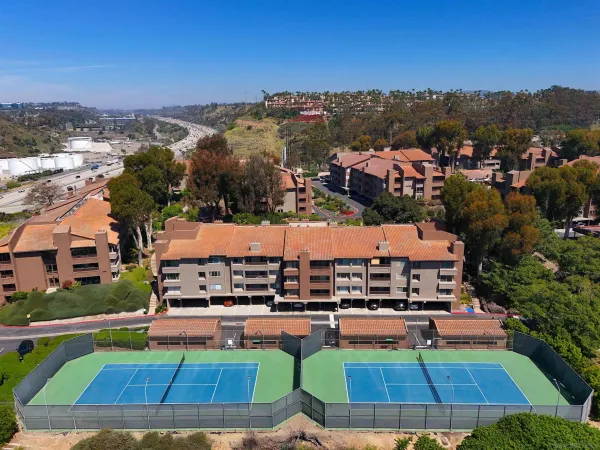 a aerial view of multiple houses with a yard