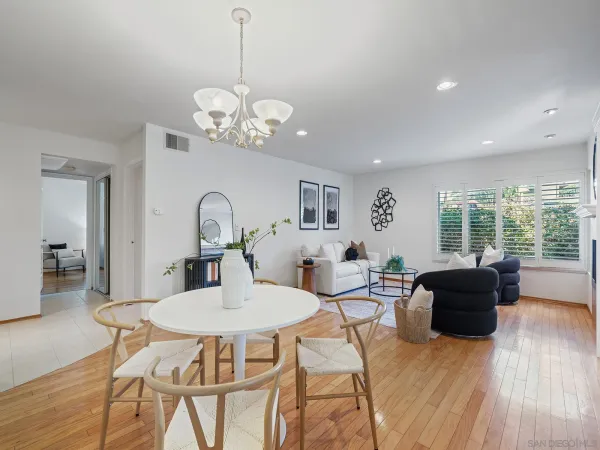 a view of a dining room with furniture window and wooden floor