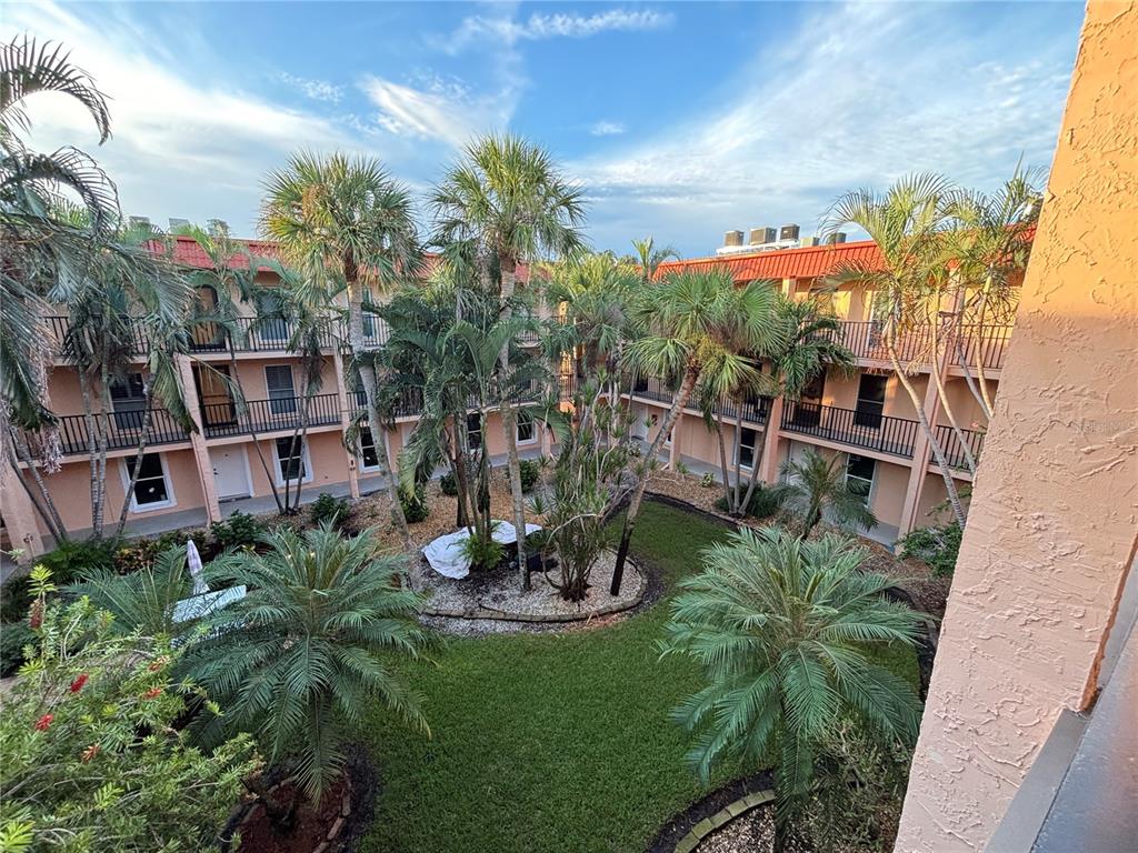 a view of a chairs and table in patio