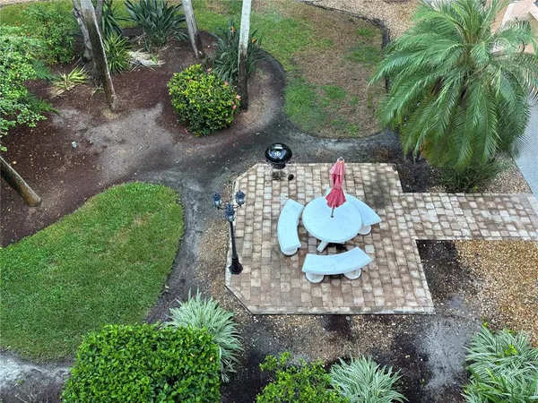 a vase of flowers sitting on a floor