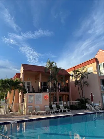 a front view of house with yard and outdoor seating