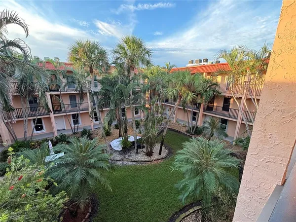 a view of a chairs and table in patio