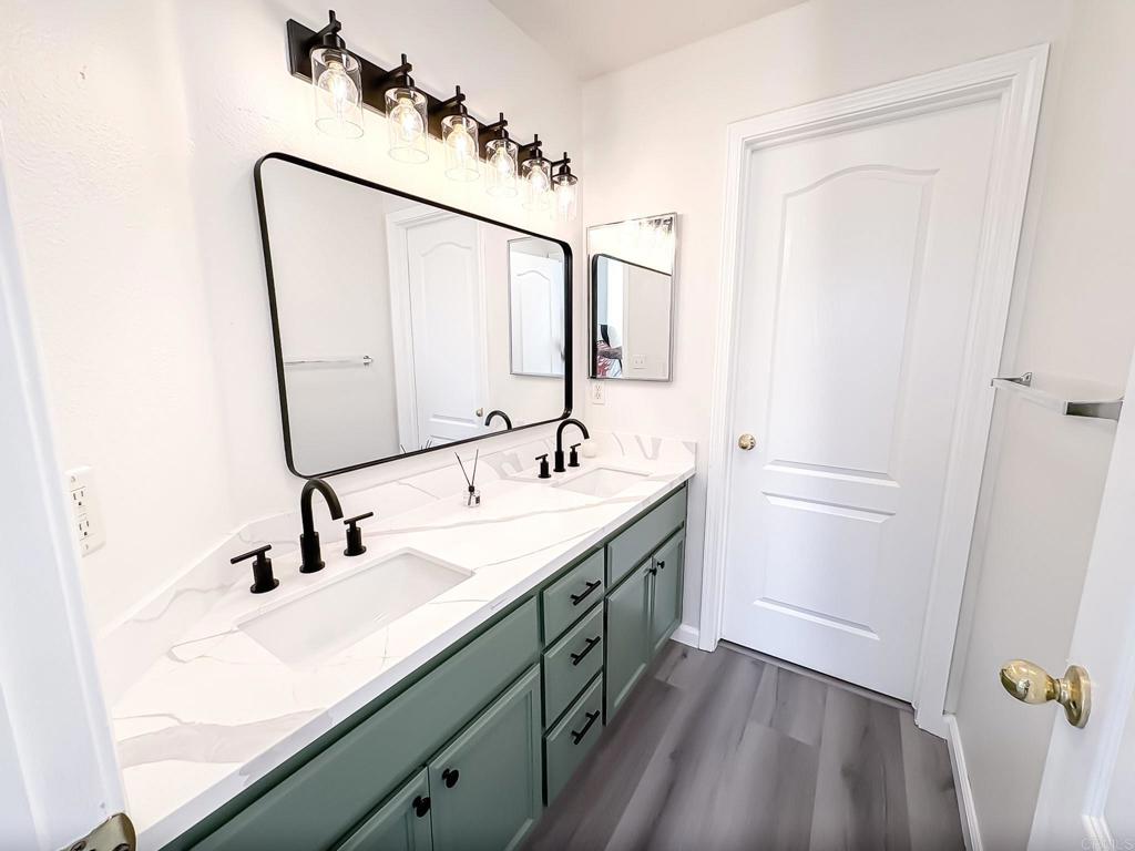 3005 Litt Road Modesto, CA 95355 - Photo 33 of 53 a bathroom with a double vanity sink and a mirror
