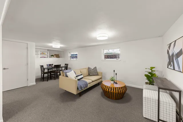 a living room with furniture and a table