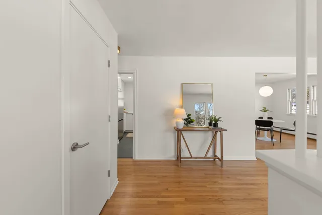 a view of a kitchen with a table and chairs