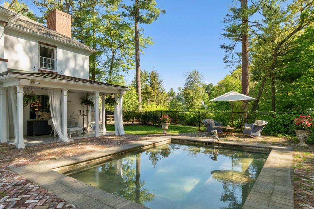 107 Independence Road Concord, MA 01742 - Photo 18 of 25 a swimming pool with outdoor seating and yard