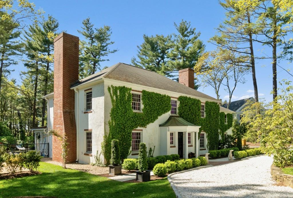 107 Independence Road Concord, MA 01742 - Photo 2 of 25 a front view of a house with a garden