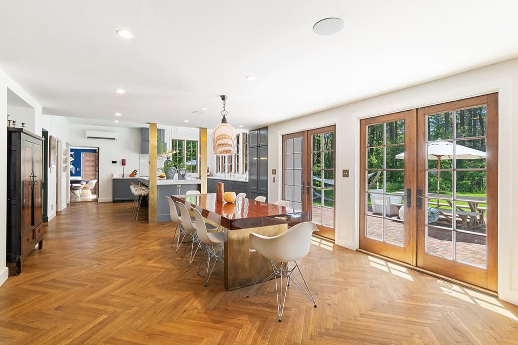 107 Independence Road Concord, MA 01742 - Photo 3 of 25 a dining room with furniture and a floor to ceiling window