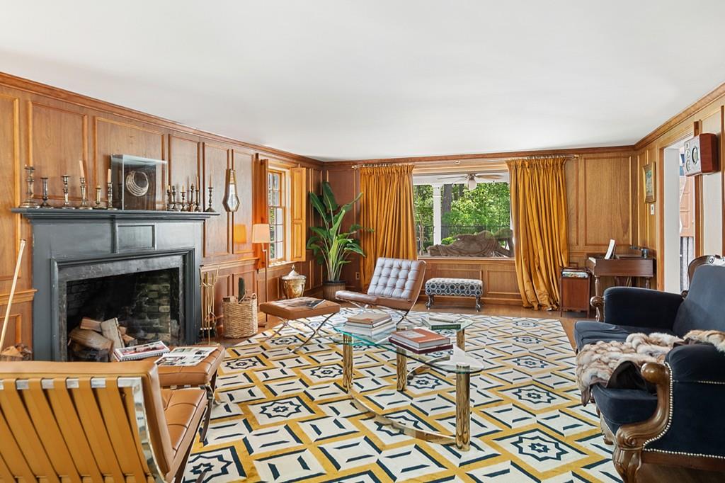 107 Independence Road Concord, MA 01742 - Photo 10 of 25 a living room with furniture large window and a fireplace