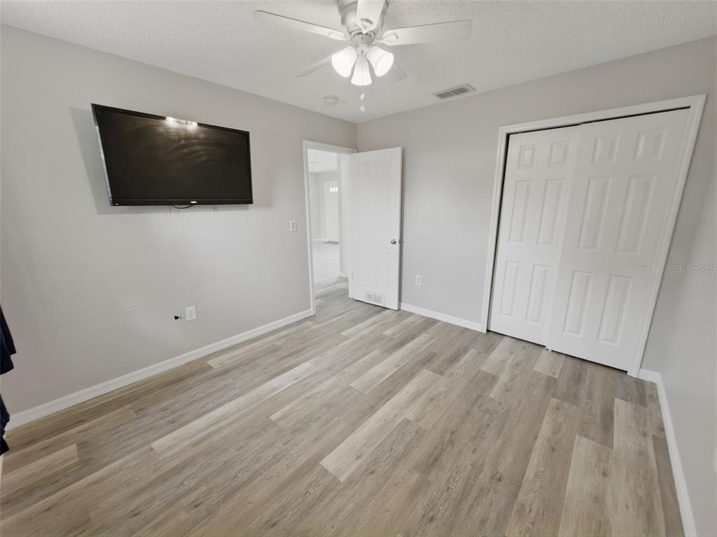 2202 Godfrey Avenue Spring Hill, FL 34609 - Photo 29 of 36 a view of a livingroom with a flat screen tv