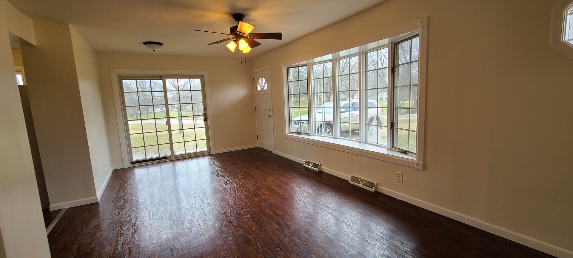 2225 Daysville Road Oregon, IL 61061 - Photo 2 of 28 a view of an empty room with wooden floor and a window