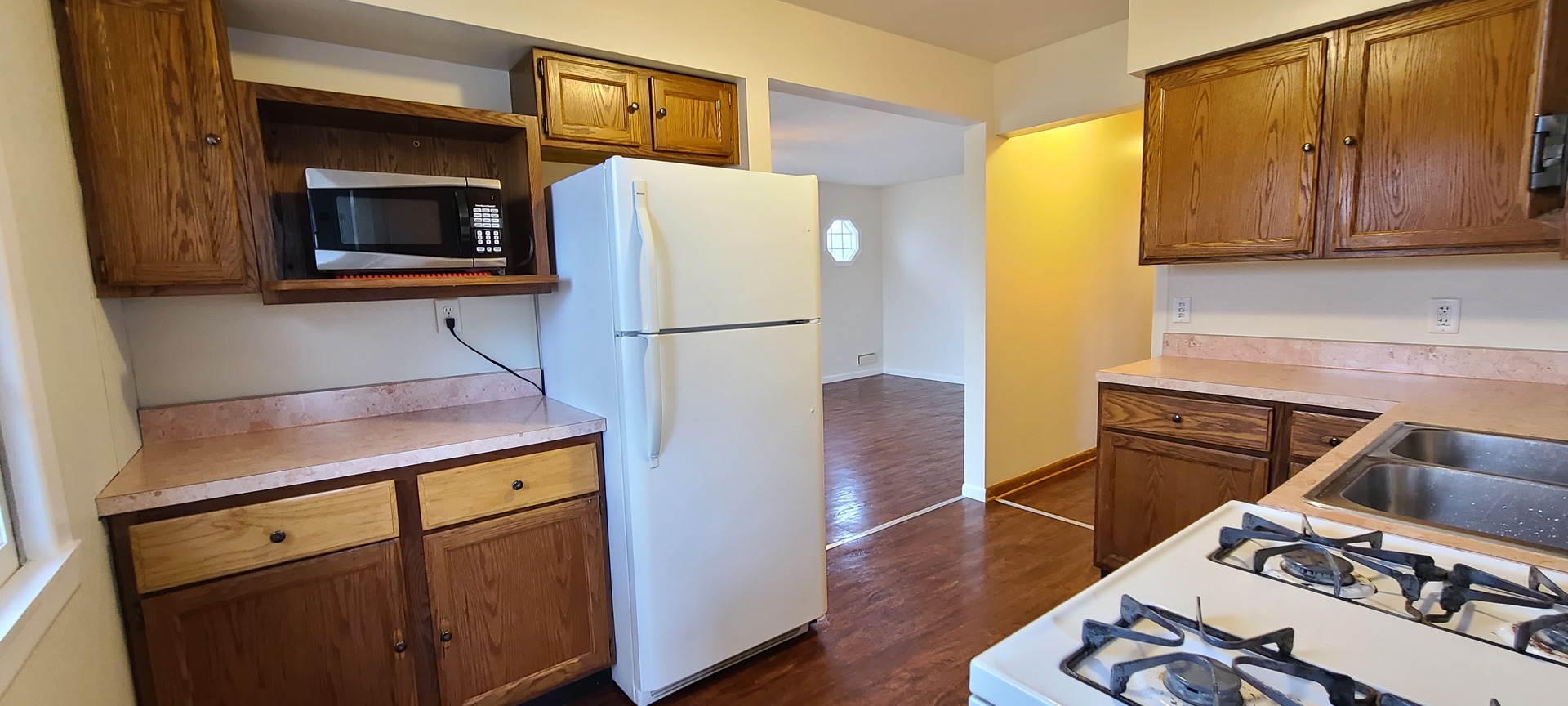 2225 Daysville Road Oregon, IL 61061 - Photo 18 of 28 a kitchen with a refrigerator and a stove top oven