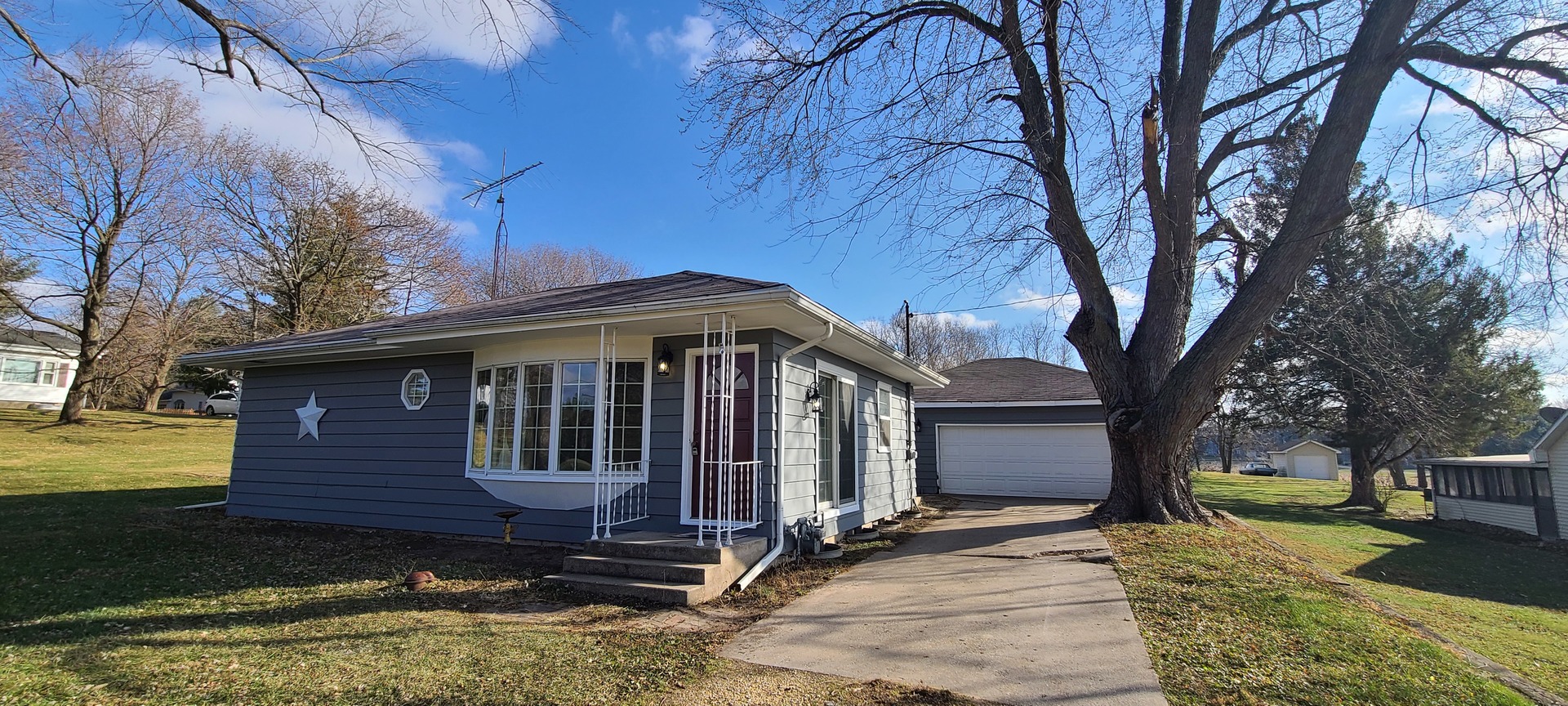 2225 Daysville Road Oregon, IL 61061 - Photo 23 of 28 a front view of a house with a yard and garage
