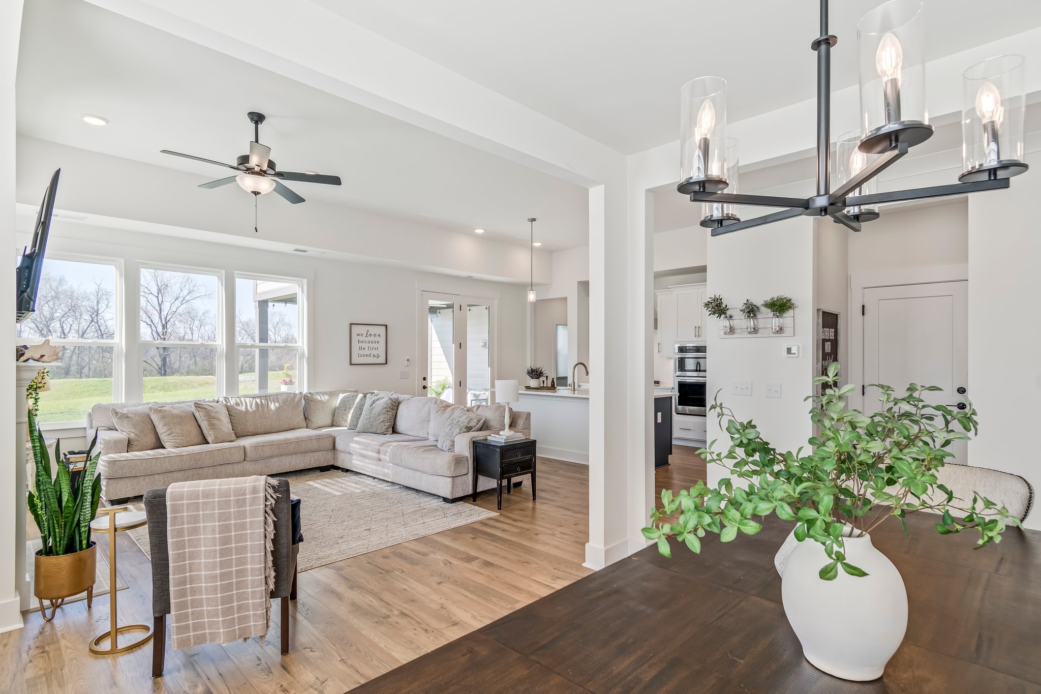 4028 John Marsh Road Spring Hill, TN 37174 - Photo 11 of 62 a living room with furniture potted plant and a chandelier