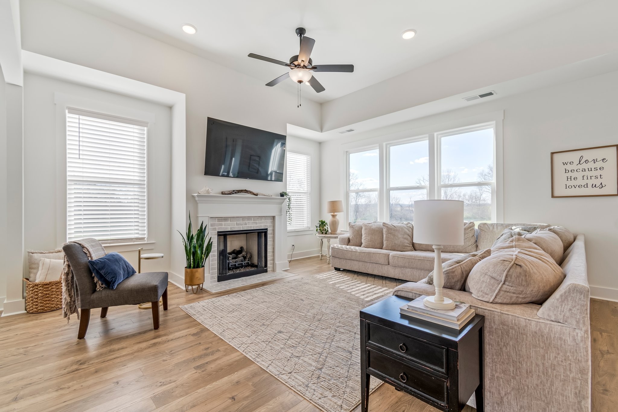 4028 John Marsh Road Spring Hill, TN 37174 - Photo 14 of 62 a living room with furniture a fireplace and a flat screen tv