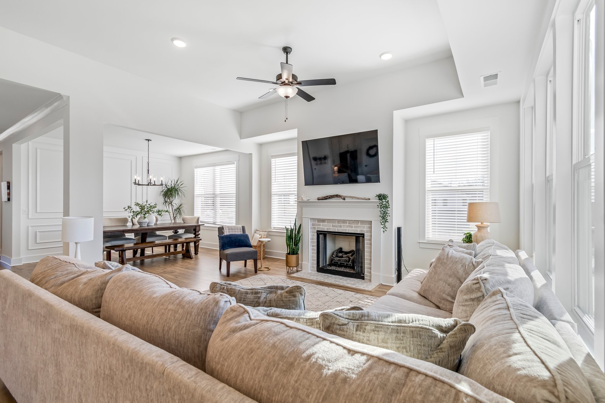 4028 John Marsh Road Spring Hill, TN 37174 - Photo 18 of 62 a living room with furniture fireplace and flat screen tv