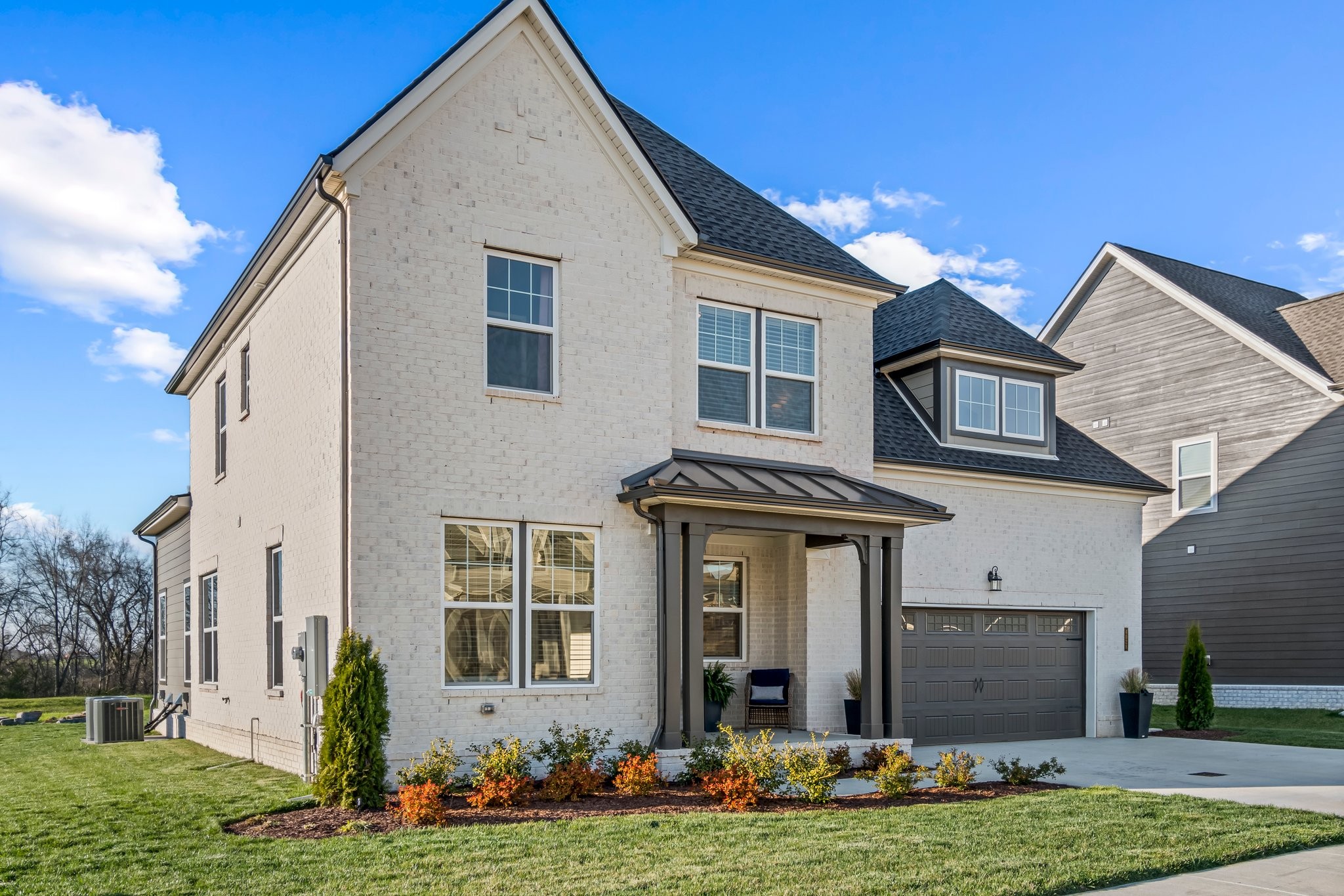 4028 John Marsh Road Spring Hill, TN 37174 - Photo 2 of 62 a front view of a house with a yard and garage