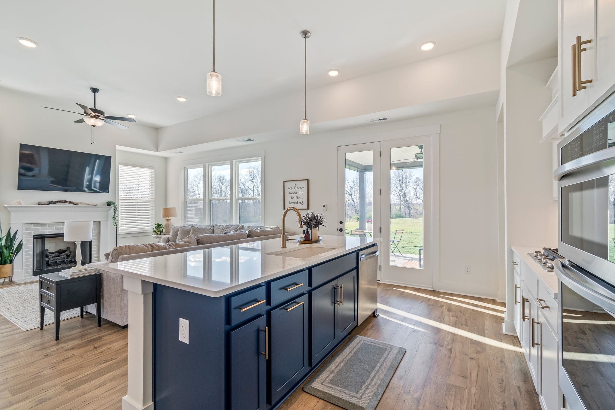 4028 John Marsh Road Spring Hill, TN 37174 - Photo 24 of 62 a large kitchen with kitchen island granite countertop a stove oven and a sink with granite countertops
