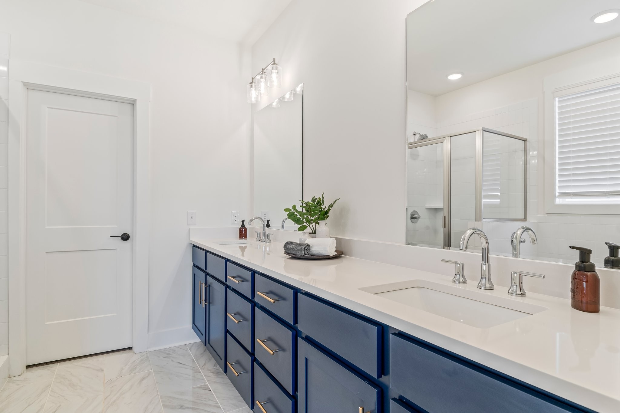 4028 John Marsh Road Spring Hill, TN 37174 - Photo 31 of 62 a bathroom with a sink and a mirror
