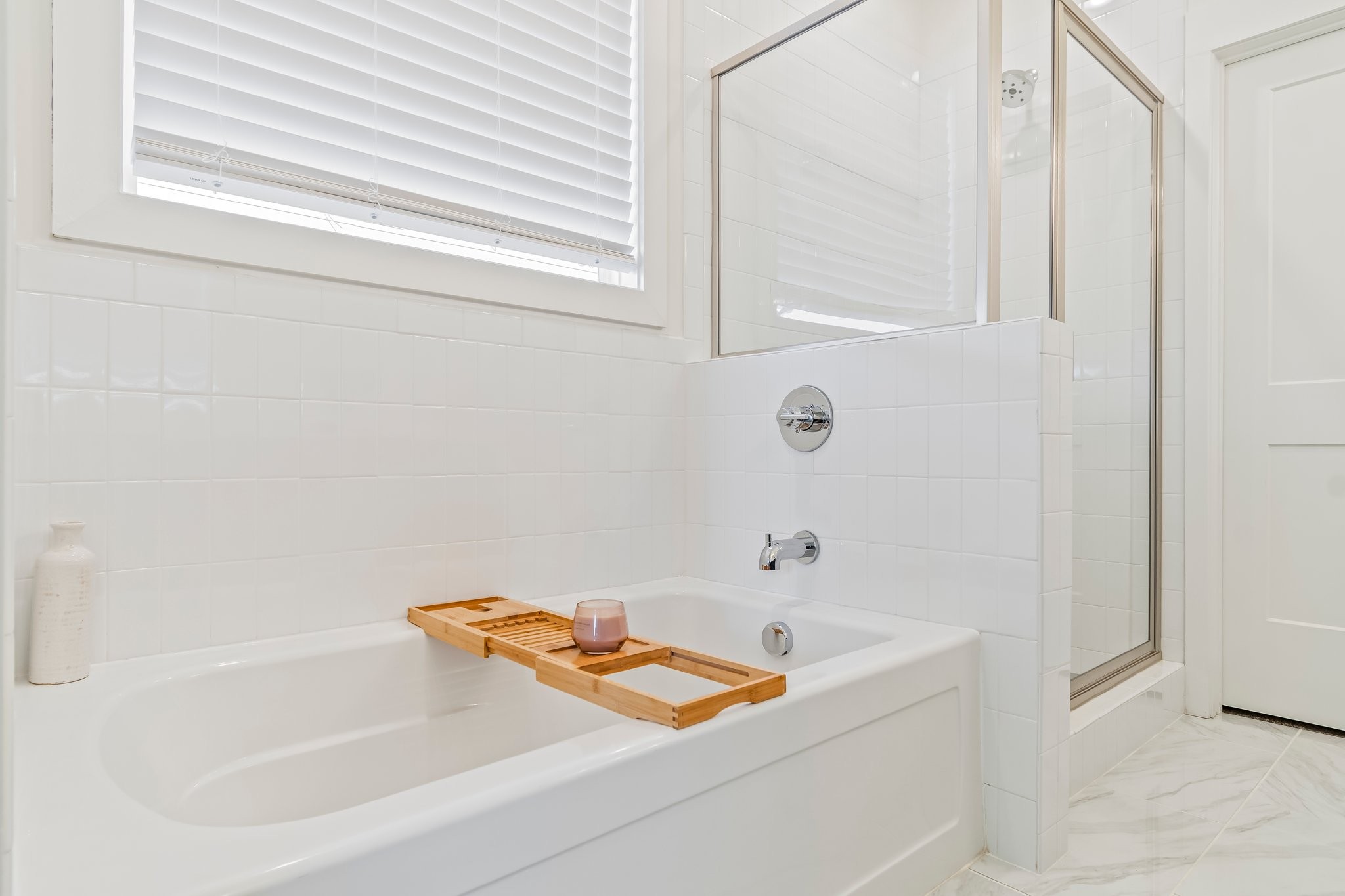 4028 John Marsh Road Spring Hill, TN 37174 - Photo 32 of 62 a bathroom with a tub and a shower