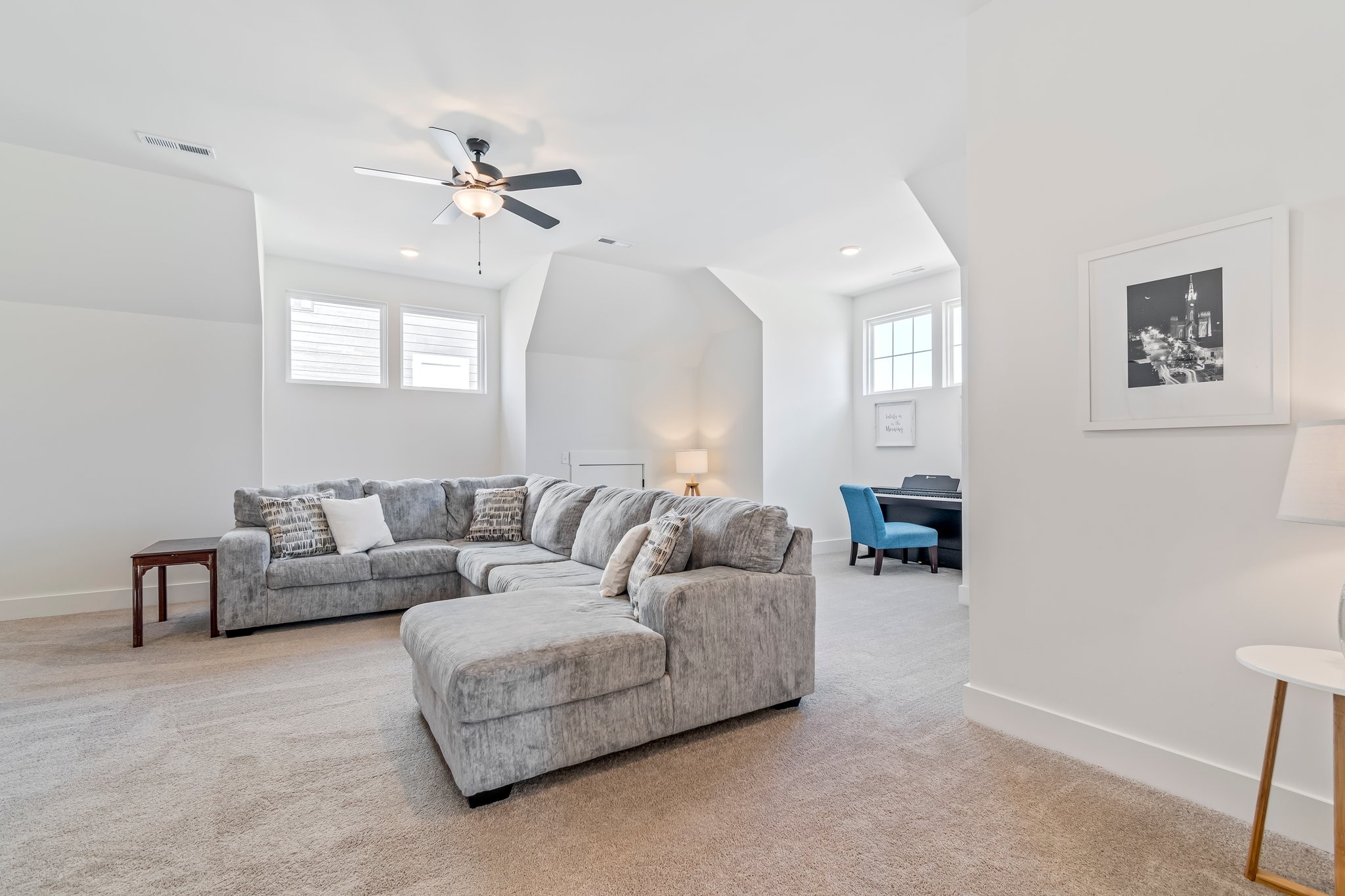 4028 John Marsh Road Spring Hill, TN 37174 - Photo 34 of 62 a living room with furniture and a ceiling fan
