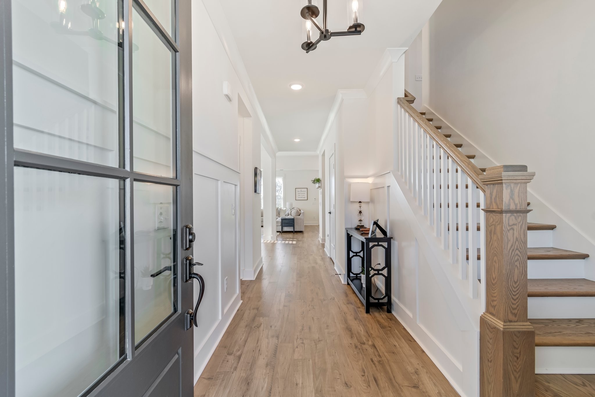 4028 John Marsh Road Spring Hill, TN 37174 - Photo 4 of 62 a view of a hallway with wooden floor and staircase