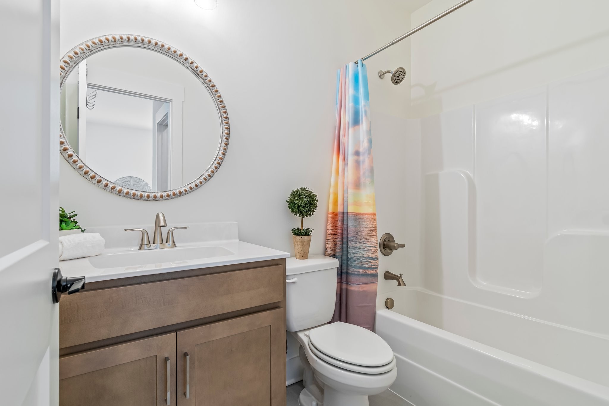 4028 John Marsh Road Spring Hill, TN 37174 - Photo 44 of 62 a bathroom with a sink a toilet and a mirror