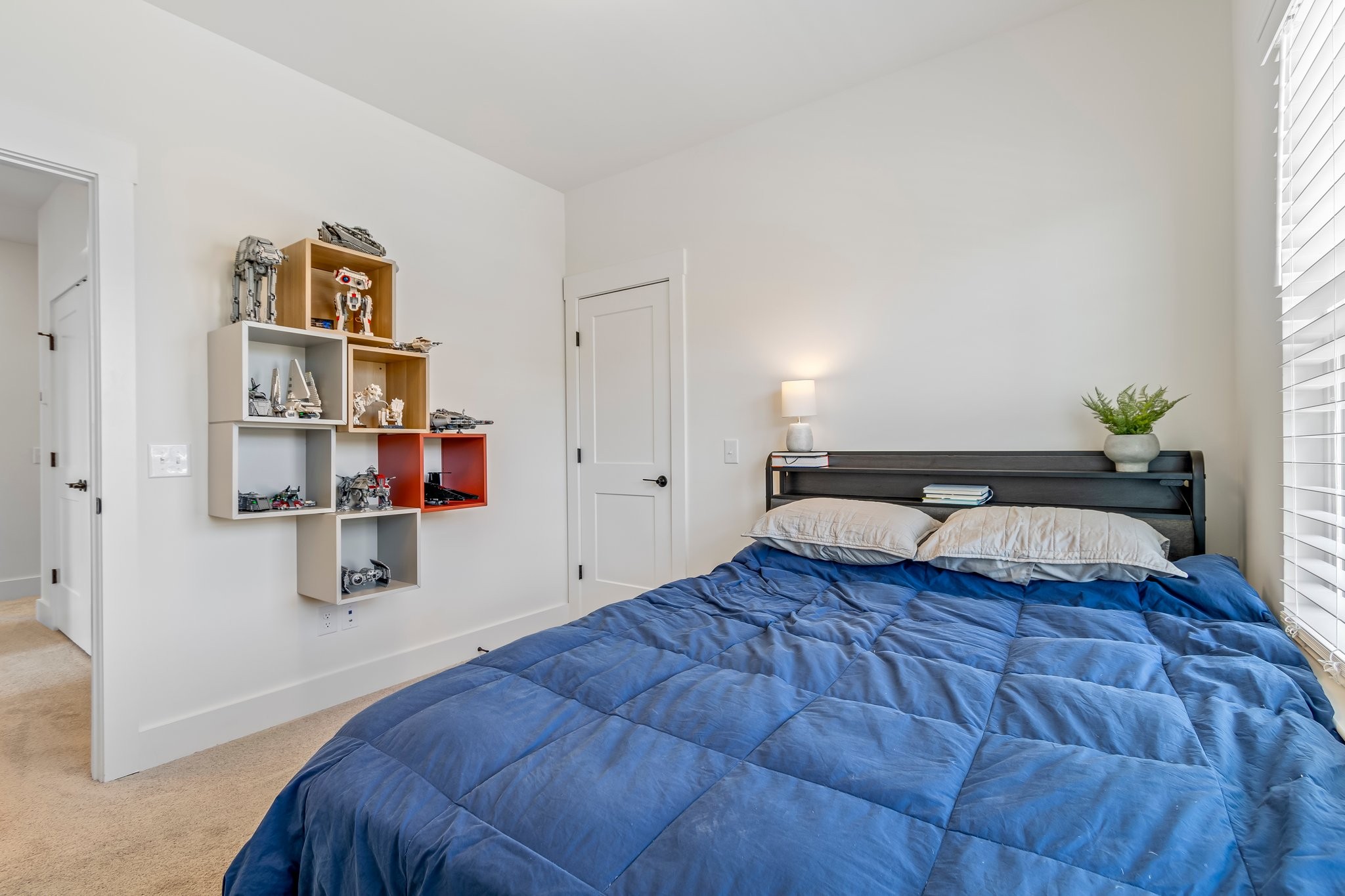 4028 John Marsh Road Spring Hill, TN 37174 - Photo 52 of 62 a bedroom with a bed and book shelf